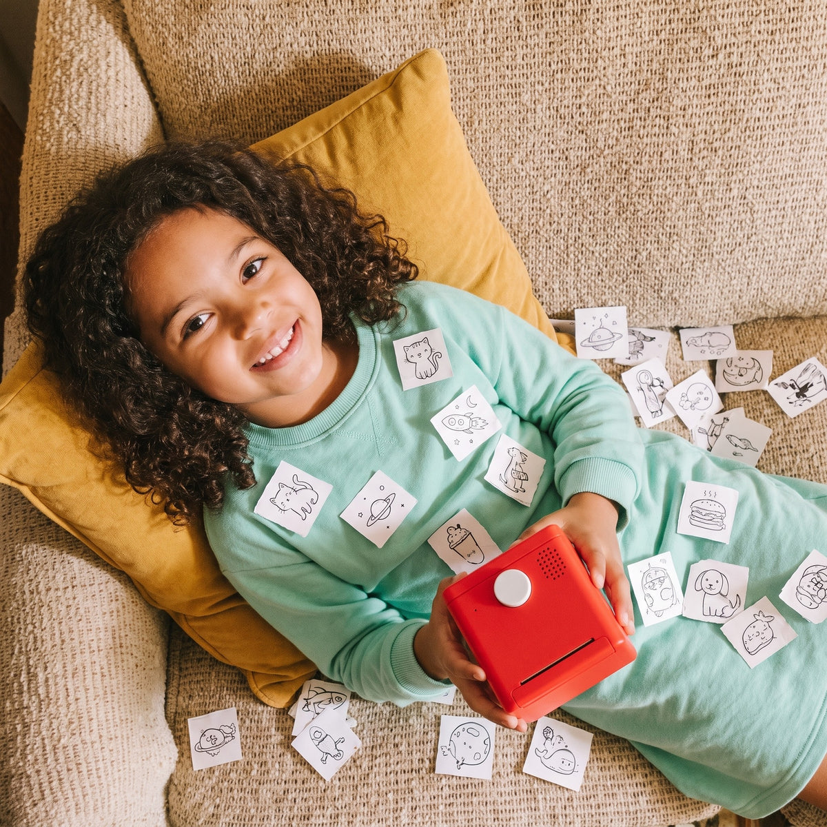 Girl on the couch with her stickers
