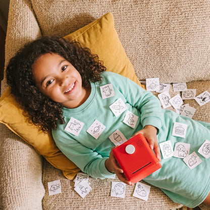 Girl on the couch with her stickers