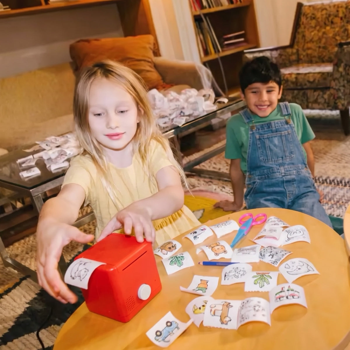 Two kids printing stickers together